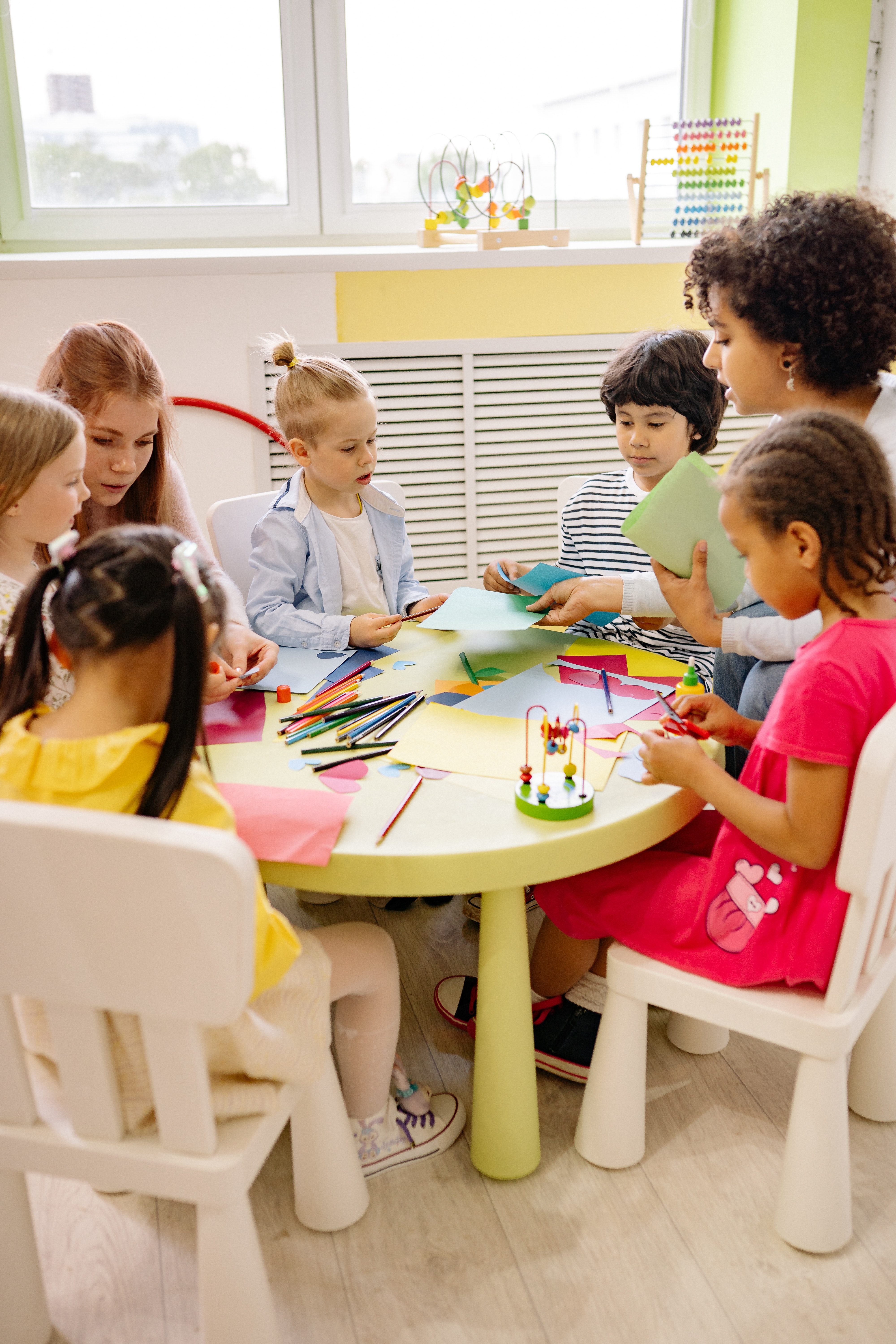 Photo by Yan Krukau from Pexels: https://www.pexels.com/photo/children-sitting-on-chairs-in-front-of-table-with-art-materials-8613059/